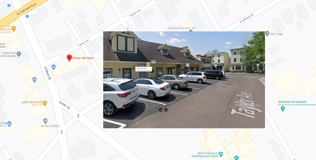 A picture of a showing South Main Street of Doylestown and Taylor Avenue with a Red location bubble signifying the location of Moxie Hair salon. Also embedded in the picture a visual of the building showing which door is Moxie Hair Salon. it is the 3rd door down. Entrance is wheelchair accessible